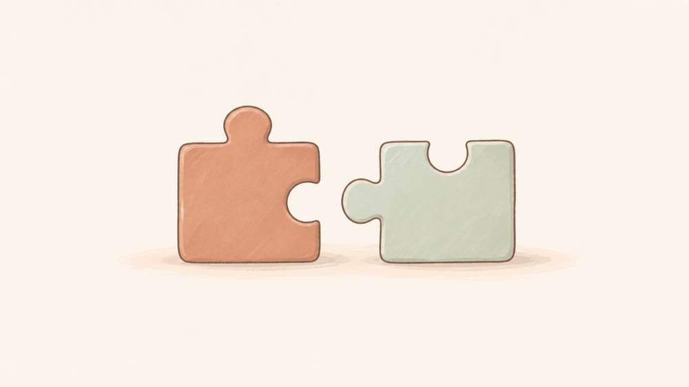 机の上に置かれた2つのパズルのピースが、かたちが違っていてぴたりとは合わないイラスト